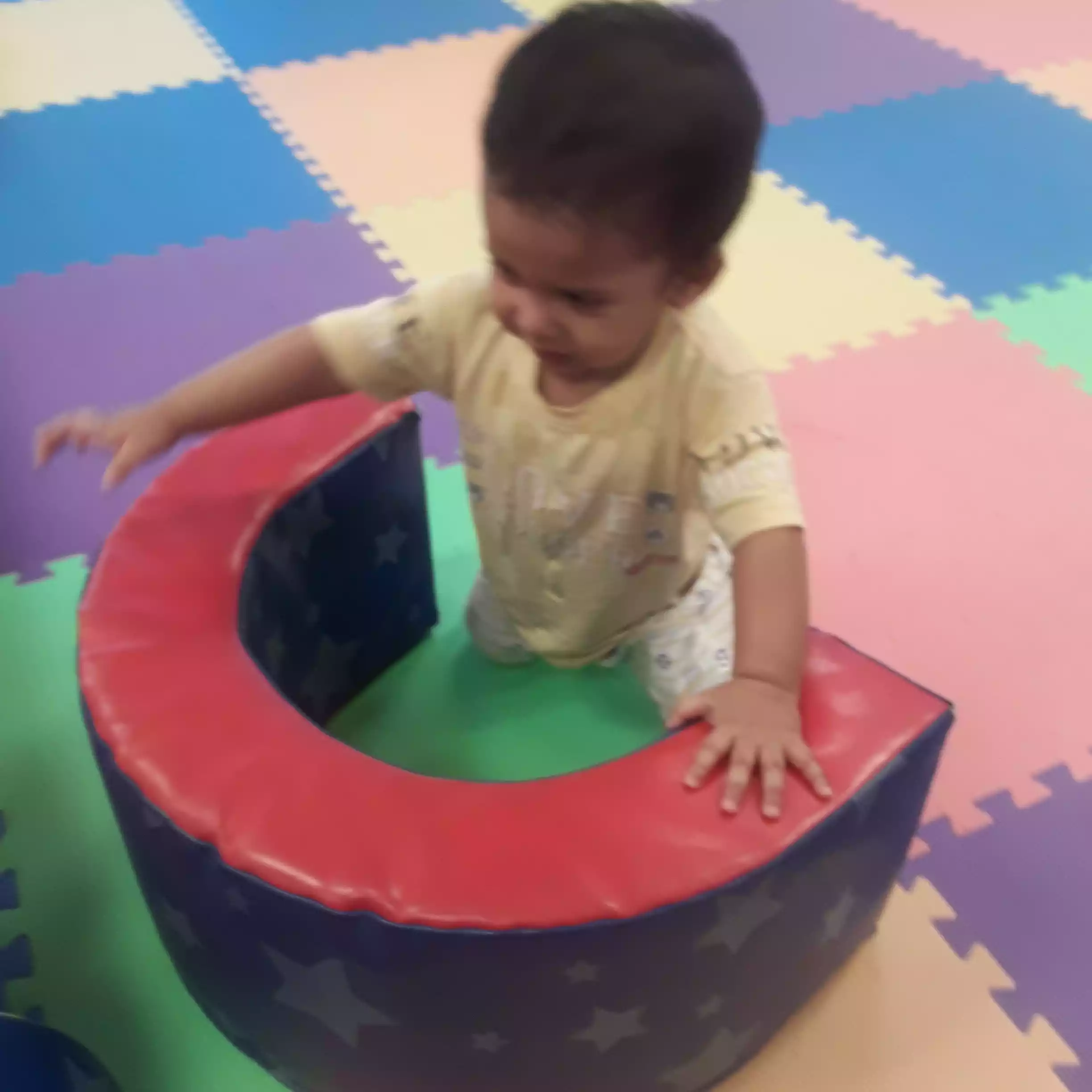 Infant Crawling and Exploring Soft Foam Blocks Baby crawling and exploring soft foam climber in infant program